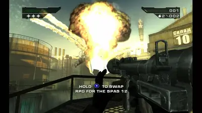 Holding a rocket launcher in BLACK as a huge explosion erupts over an industrial depot, with an on-screen prompt to swap it for the SPAS 12