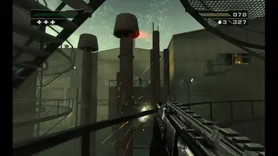 First-person view with an assault rifle under industrial chimneys in BLACK, looking across a foundry yard